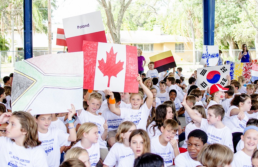 Students show off their class'       flags.
