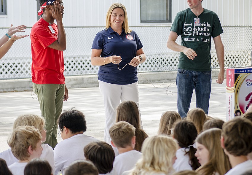 The 2016 U.S. Women'      s Gymnastics Team coach Aimee Boorman speaks to students at Southside Elementary School.