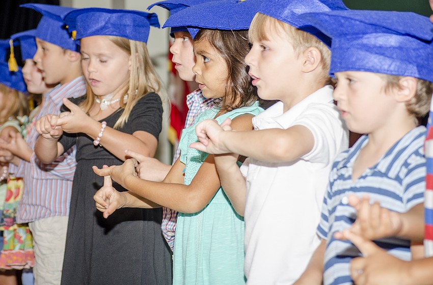 Students perform for their families.
