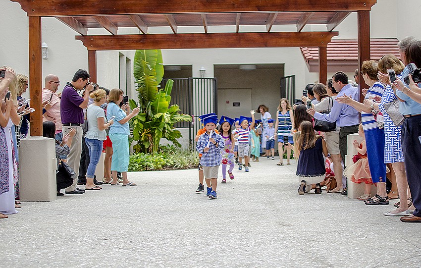 Families cheered on their students as they filed outside for the final portion of the First Presbyterian Preschool graduation ceremony.