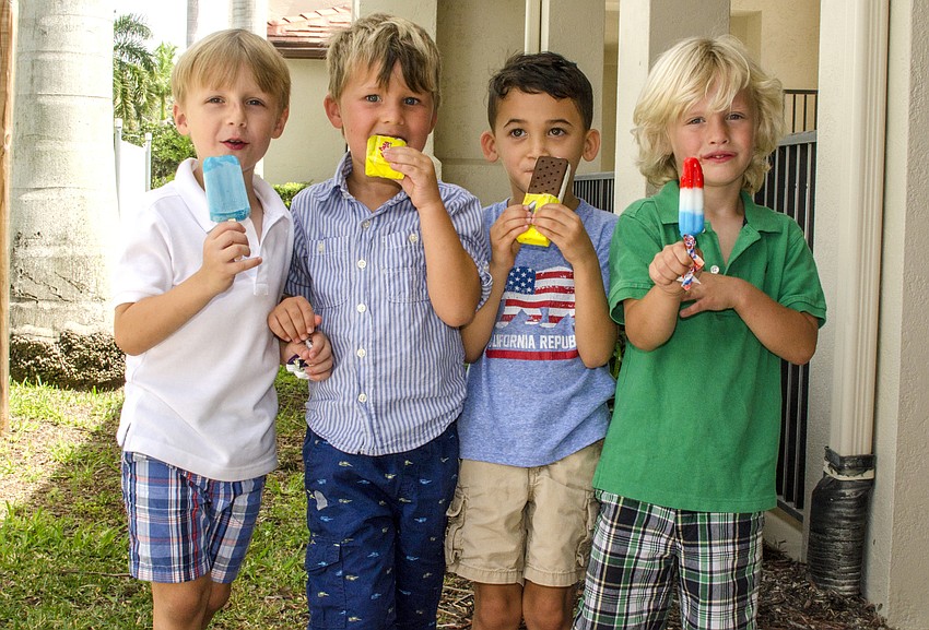 Henry Greenwell, Asher Morrissey, Holden DeGuzman and Mitchell Wrigley pose with their ice cream after the First Presbyterian Preschool graduation ceremony.