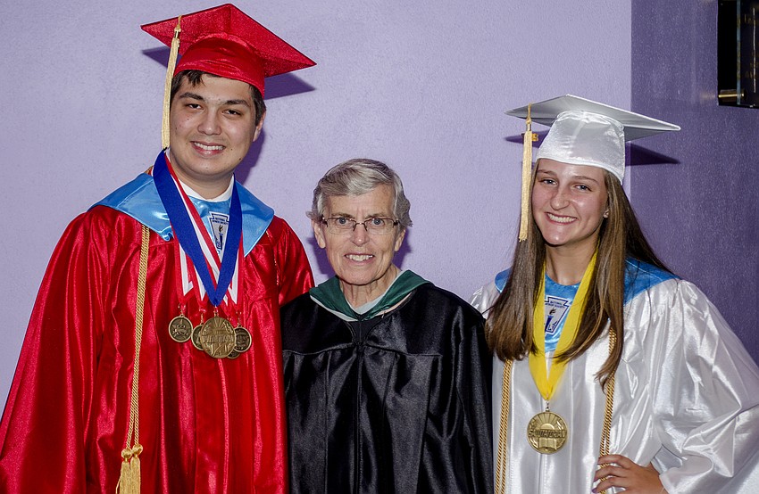 Valedictorian Matthew Twargoski, Cardinal Mooney President Sister Lucia Haas and Salutatorian Erin McConnell