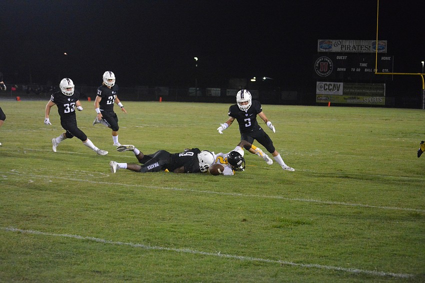 Jesse Joseph (9) strips a Lakewood player of the ball as Noah Font (3) pounces on it.