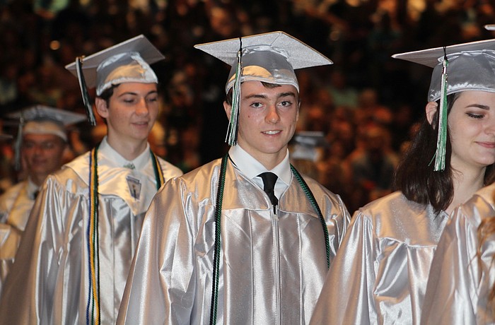 Lakewood Ranch High School graduate Ian Griffin takes his seat before the start of the graduation ceremony.