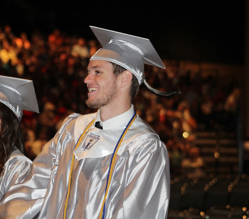 Lakewood Ranch High School graduate Tommy Wolfe celebrates during the graduation ceremony.