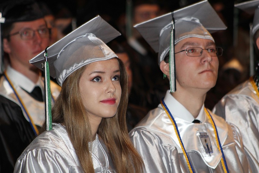 Lakewood Ranch High School graduate Rachel Johnson watches her senior class video during the graduation ceremony.