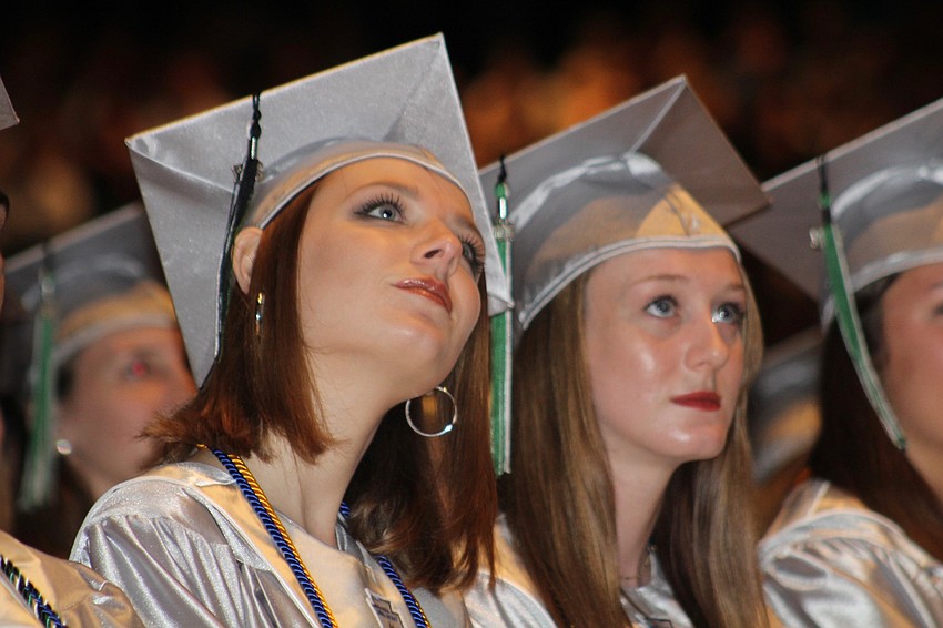 Lakewood Ranch High School graduates Sierra Barber and Alyssa Barnsley watch their senior class video.