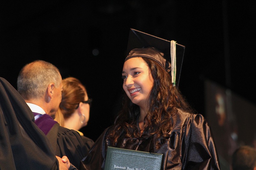Lakewood Ranch High School graduate Sion Hernandez receives her high school diploma.