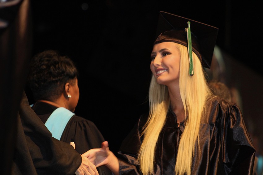 Lakewood Ranch High School graduate Jordan Koehler is congratulated after receiving her high school diploma.