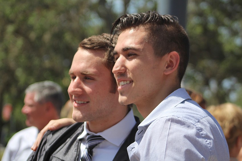 Lakewood Ranch High School graduate Evan Ferber celebrates with his brother, Jonah Ferber, after graduation.