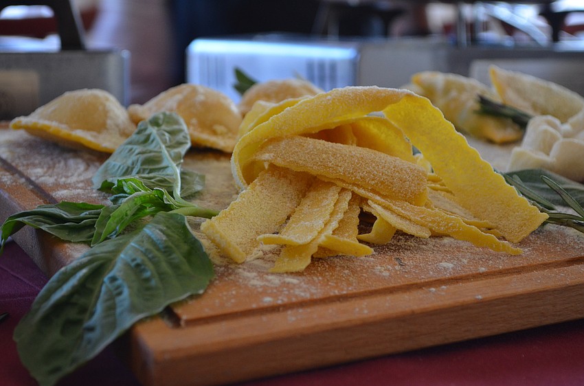 Saluté served agnolotti pasta.