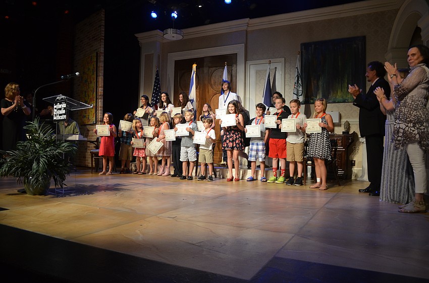 Winning playwrights pose for photos.