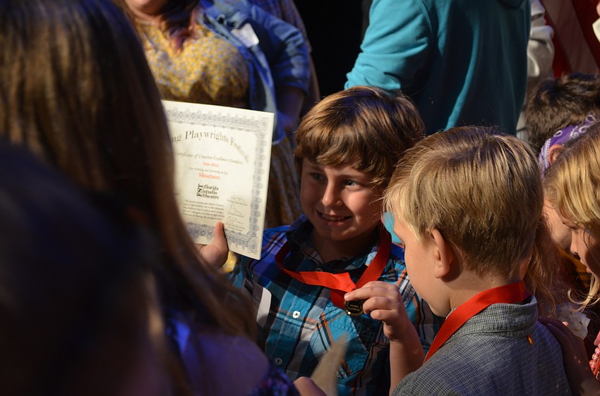 Winning playwrights pose for photos.