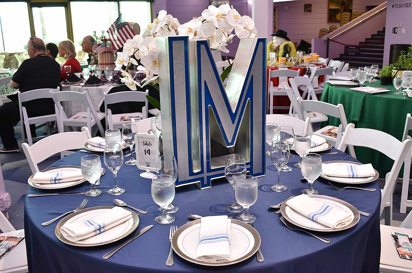 Table 17 guests adorned their table with an orchid and initial artwork at Men Who Cook & Brew on May 21 at Mattison’s Bayside at Van Wezel Performing Arts Hall.