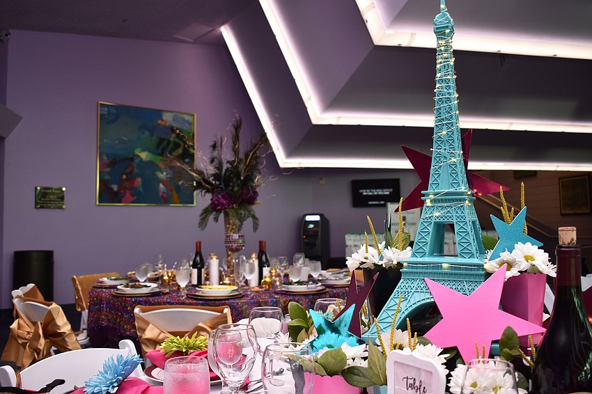 Table 13 guests put a little joie de vivre into their Parisian-themed decor for their table at Men Who Cook & Brew on May 21 at Mattison’s Bayside at Van Wezel Performing Arts Hall.