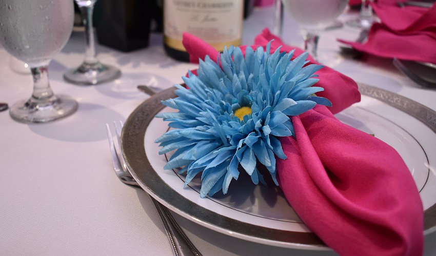 Table 13 guests put a little joie de vivre into their Parisian-themed decor for their table at Men Who Cook & Brew on May 21 at Mattison’s Bayside at Van Wezel Performing Arts Hall.