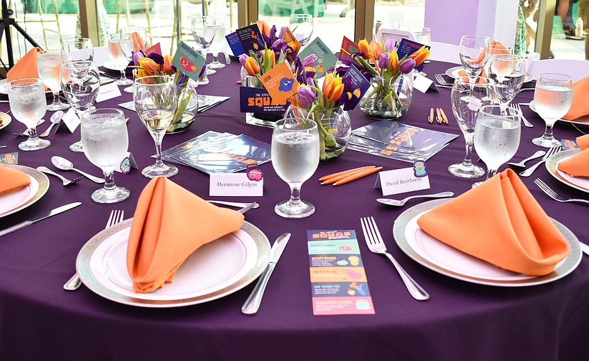 Table 3 guests — all employees or supporters of Gulf Coast Community Foundation — went with an orange and purple theme for their table decor (which matches the colored marketing materials for the foundation’s latest campaign) at M