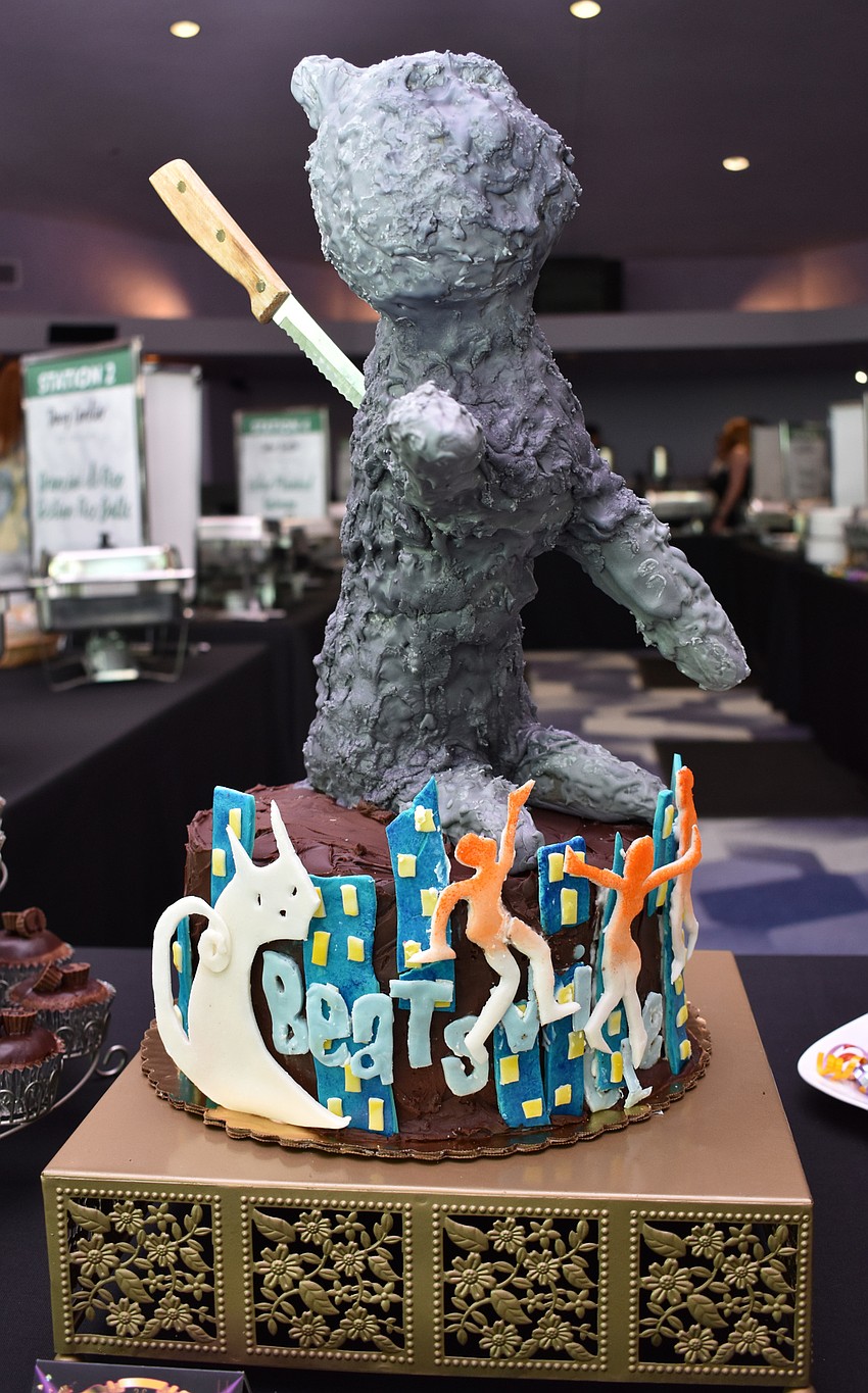 A Beatsville Musical-themed cake depicting a dead cat was auctioned off during the cake auction at Men Who Cook & Brew on May 21 at Mattison’s Bayside at Van Wezel Performing Arts Hall.