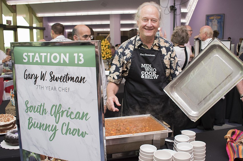 Chef Gary Sweetman shows off his South African bunny chow at his station at Men Who Cook & Brew on May 21 at Mattison’s Bayside at Van Wezel Performing Arts Hall.