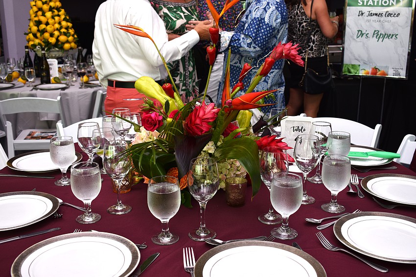Table 4 guests chose a floral theme for their colorful table at Men Who Cook & Brew on May 21 at Mattison’s Bayside at Van Wezel Performing Arts Hall.