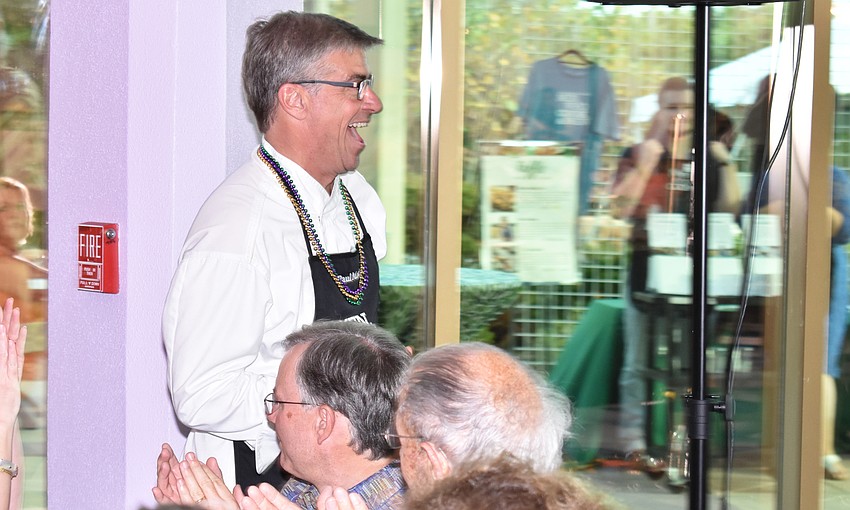 Chef Paul Mattison laughs as he makes his grand entrance at Men Who Cook & Brew on May 21 at Mattison’s Bayside at Van Wezel Performing Arts Hall.