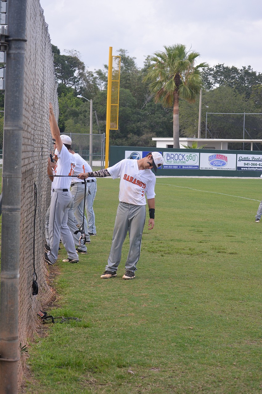 Nick Winkelmeyer and the Sailors stretch prior to the game.