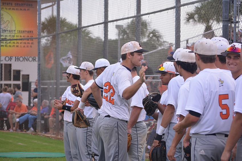 Brooks Larson (22) gets his team amped before the game.