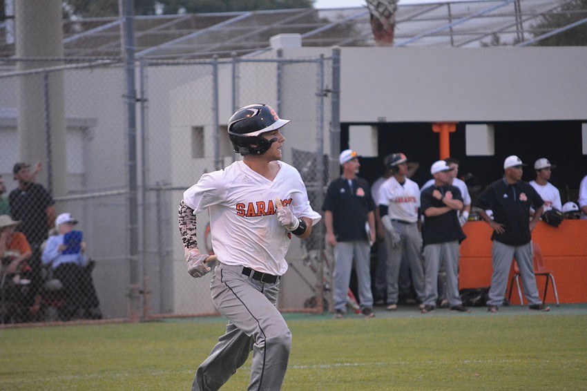 Nick Winkelmeyer watches a Steinbrenner defender make a play on his hit.