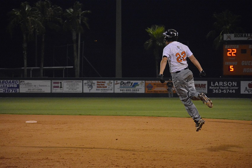 Brooks Larson leaps after hitting the go-ahead, three-run home run in the fifth inning.