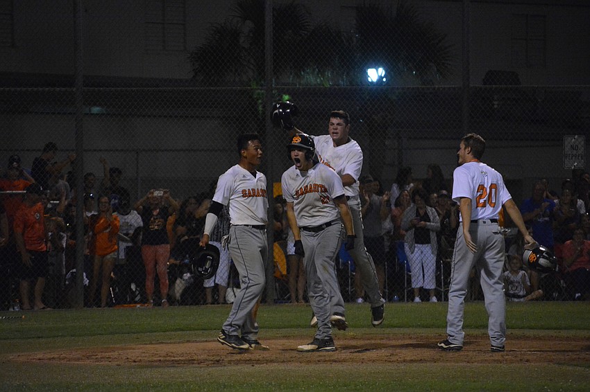 Brooks Larson screams after hitting the go-ahead, three-run home run in the fifth inning.