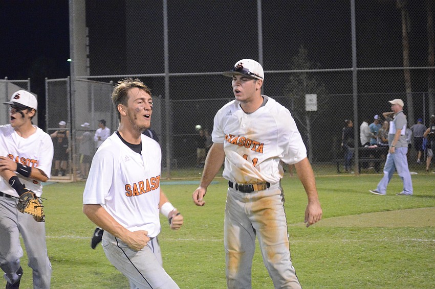 Josh Paige and Joey Arnold celebrate the victory.