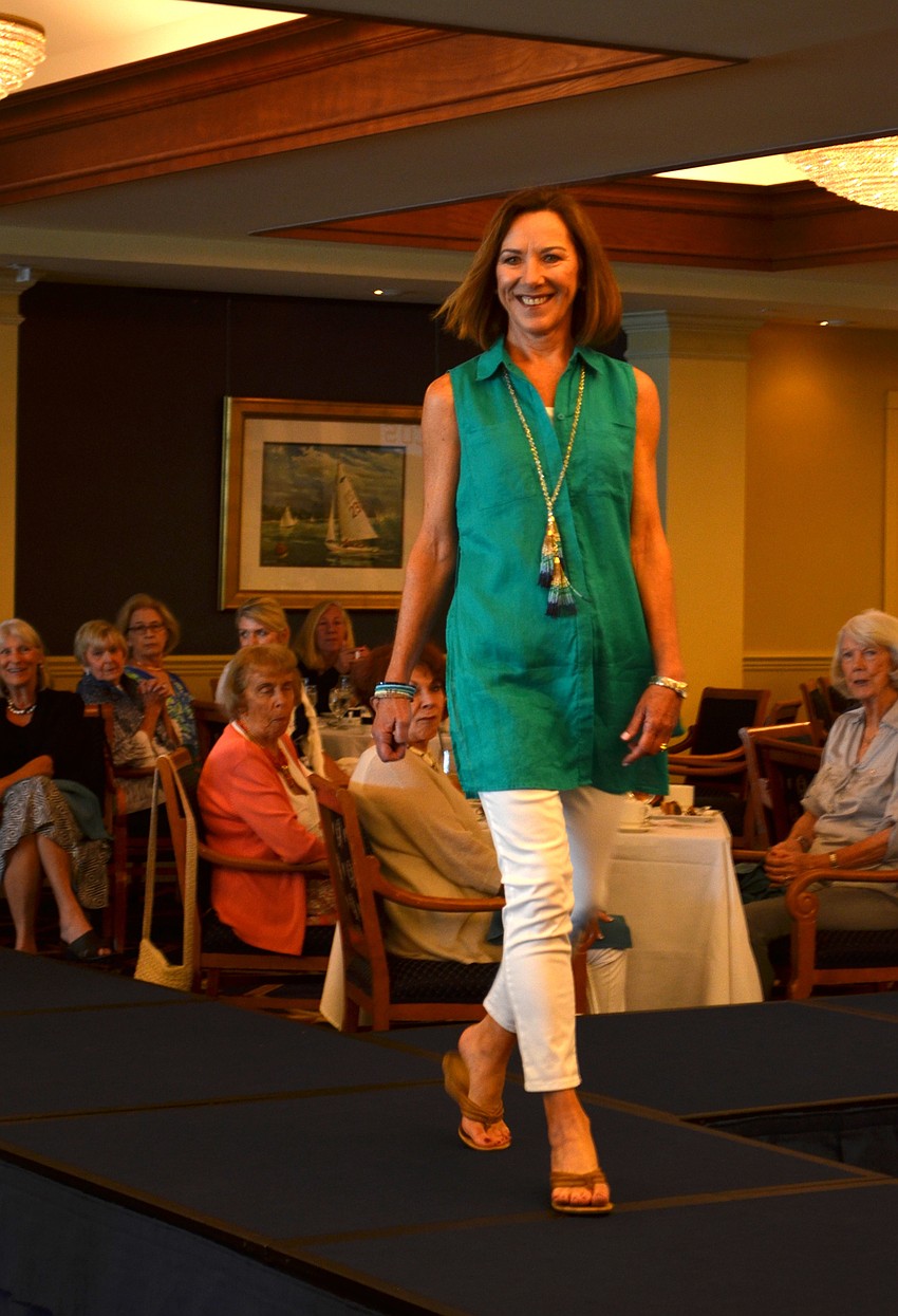 Lisa Adams is all smiles as she walks the runway.