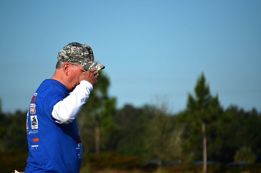 Barry Durfor salutes to gravesites.