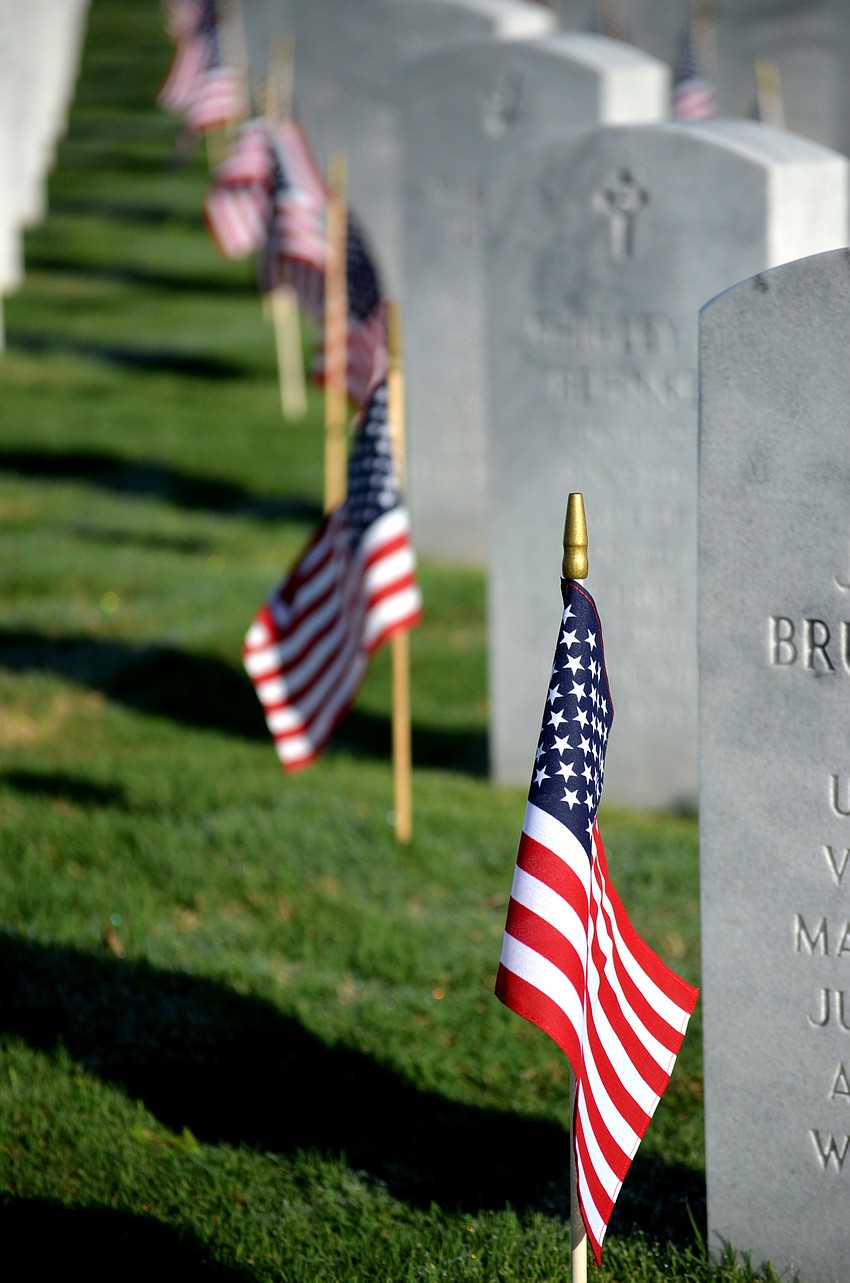 Flags were placed at each gravesite before the ceremony.