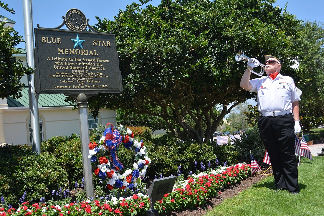 Bugler John Veenstra plays "Taps" on Sunday at the end of a ceremony to dedicate a Blue Star Memorial Marker at Lakewood Ranch Town Hall.