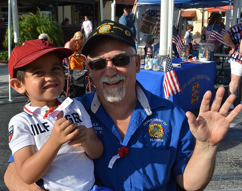 Lex Sookra, 4, and his grandpa, veteran Dave Daily of Mill Creek, get ready for the parade.