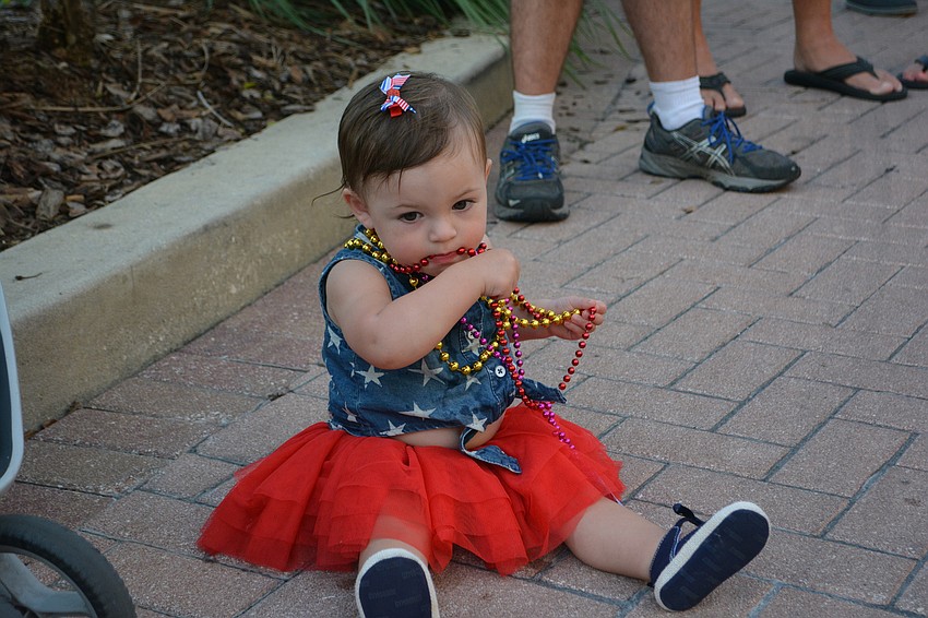 Taytum Panetta of Palmetto shows the real reason they hand out so many beads.