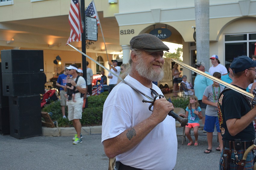 Bradenton'   s Mike Dreer, had no trouble carrying a sword, but he had better watch out for the one in front of him.