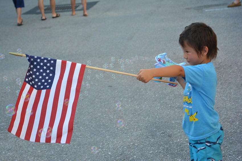 East County'   s Ethan Puttock, 4, can honor America and play with bubbles at the same time.