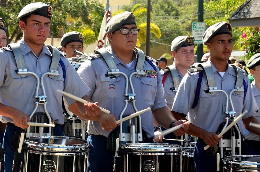 The Sarasota Military Academy Drumline marches down Main Street.