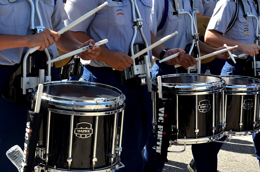 The Sarasota Military Academy Drumline marches down Main Street.