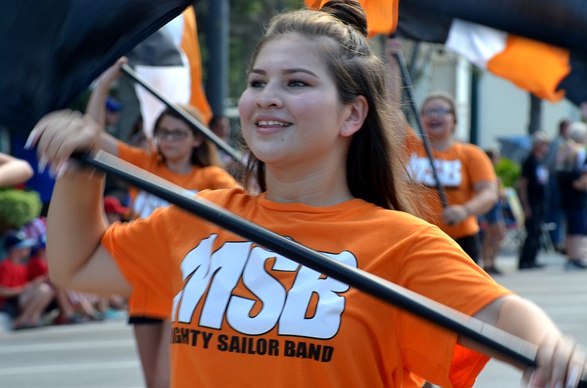 Angel Orser, of the Mighty Sailor Band of Sarasota High School, performs during the parade.