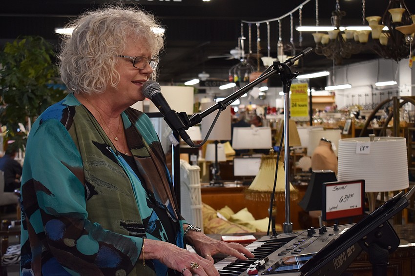 Debbie Keeton performs for guests before the program begins at the Woman'   s Exchange Awards Celebration on June 1 at Woman’s Exchange.