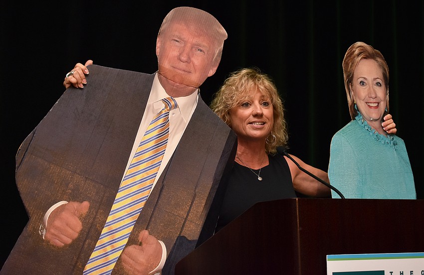 Pam McCurdy uses two props to make her opening address at the Greater Sarasota Chamber of Commerce 2017 Frank G. Berlin, Sr. Small Business Awards on June 2 at Hyatt Regency Sarasota.