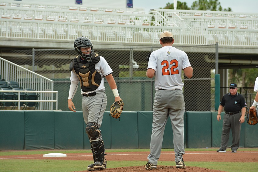 Catcher Cole Madden gives pitcher Brooks Larson encouragement on the mound.