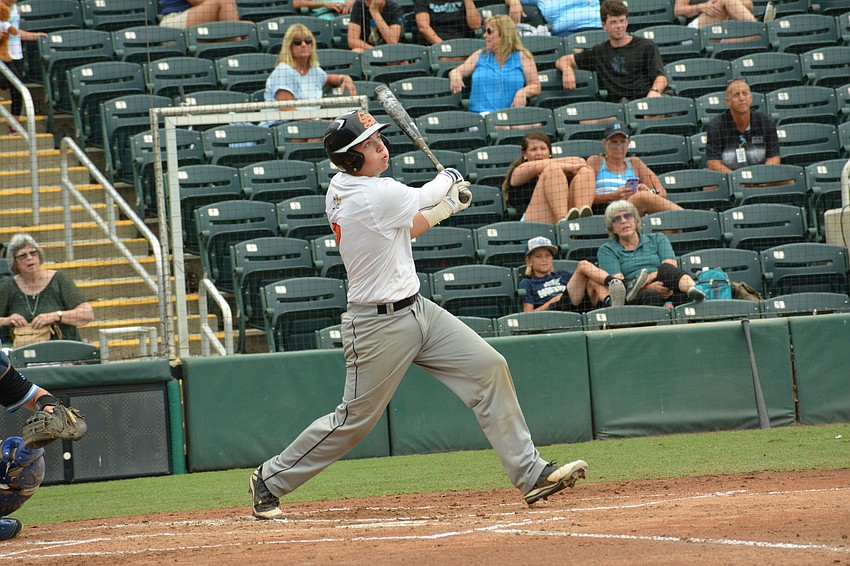 Cole Madden watches his fly ball to right field.