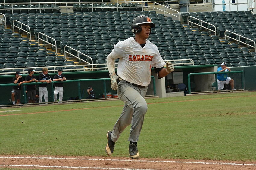 Alex Arauz hustles to first base after a hit to left field.