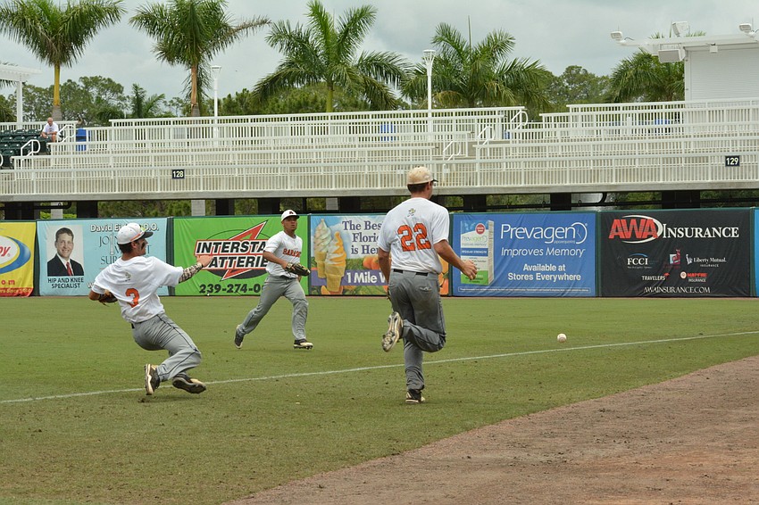 Nick Winkelmeyer, Daniel Marin and Brooks Larson chase after a foul ball, to no avail.
