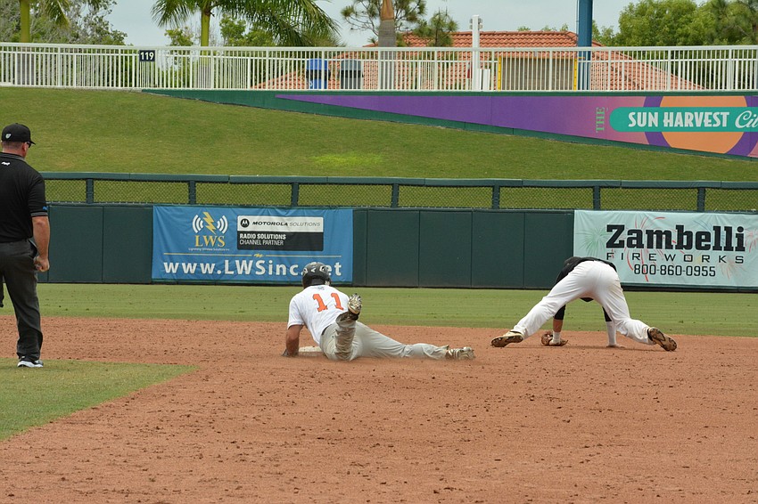 Joey Arnold slides into second base for a double.