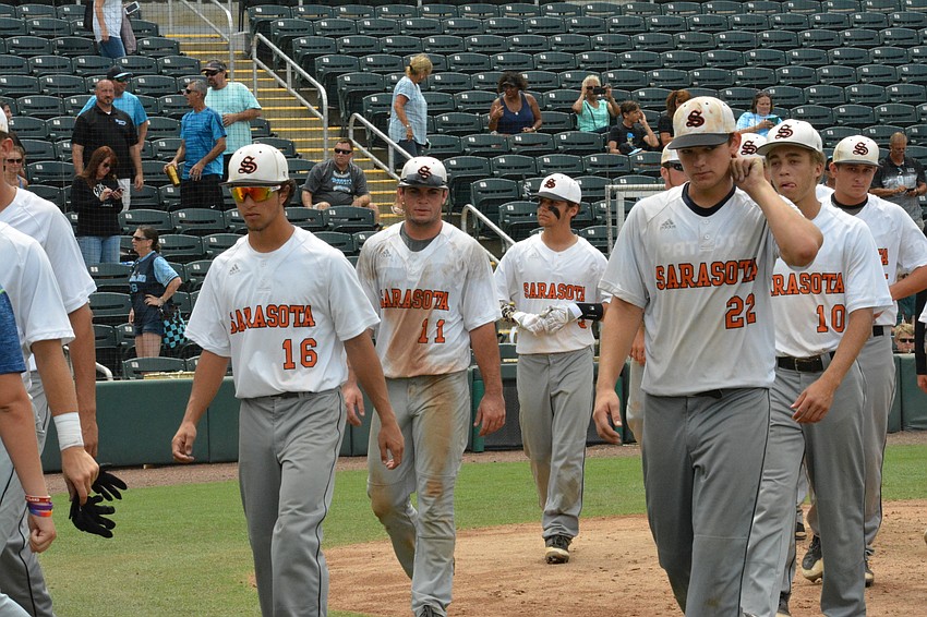 The Sailors walk off the field after the game.